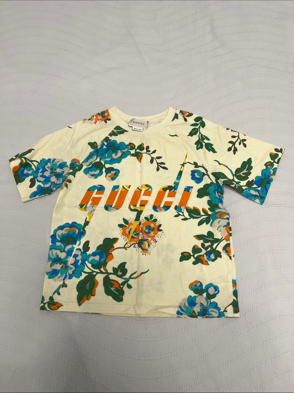 Gucci Cream Floral Tee with Blue, Green & Orange Logo